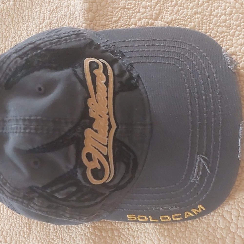 Matthew's Solcam distressed ball cap. Gray w/yellow black detailing gently warn.